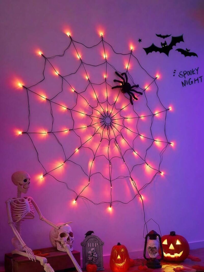 Luces LED en forma de telaraña en colores morado y anaranjado